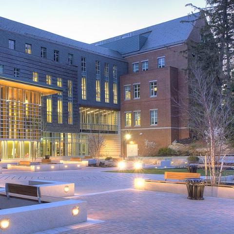 UNH Paul College building outside at dusk