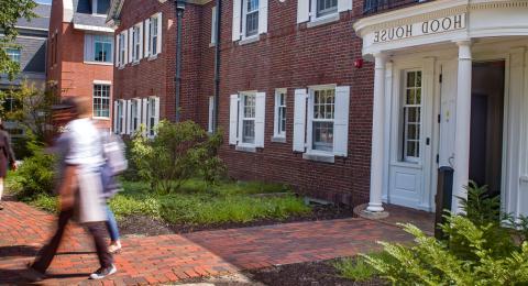 Picture of Hood House in the spring with students